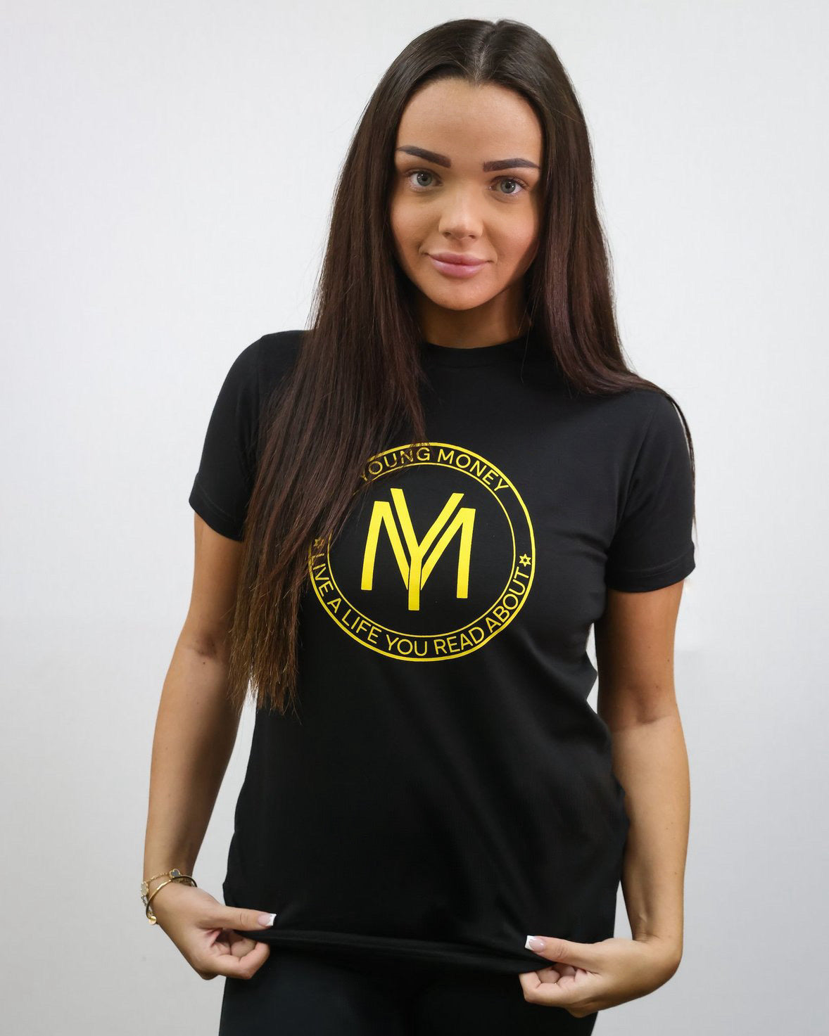 Black slim-fit T-shirt with a coloured shield design across the front with the brand's slogan in yellow on a female model size small