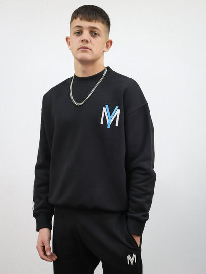 Black sweatshirt with embroidered blue YM logo on a male model size medium