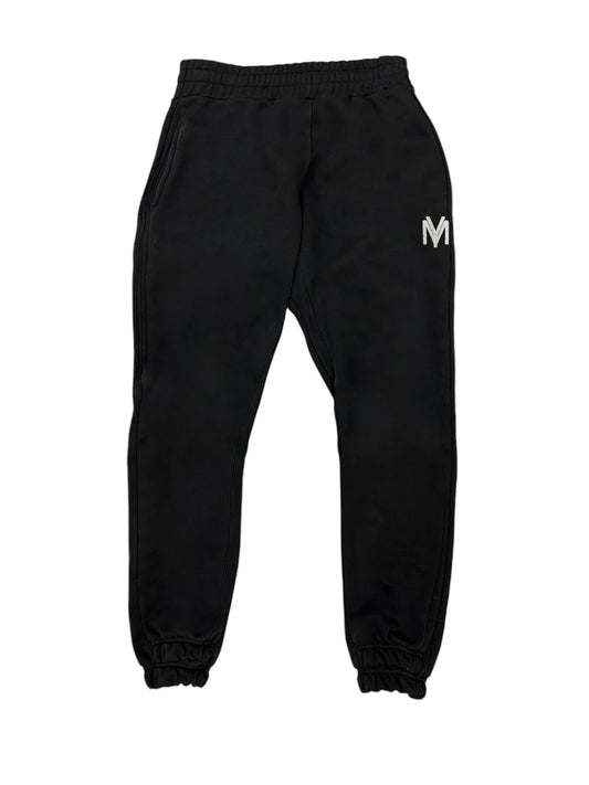 Black organic cotton joggers with a white embroidered YM logo on the left side