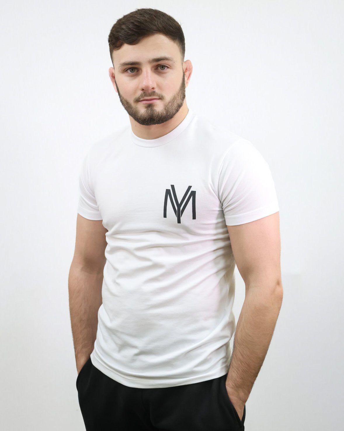 White slim-fit T-shirt with printed YM logo on a male model size medium