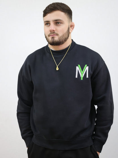 Black sweatshirt with embroidered green YM logo on a male model size medium