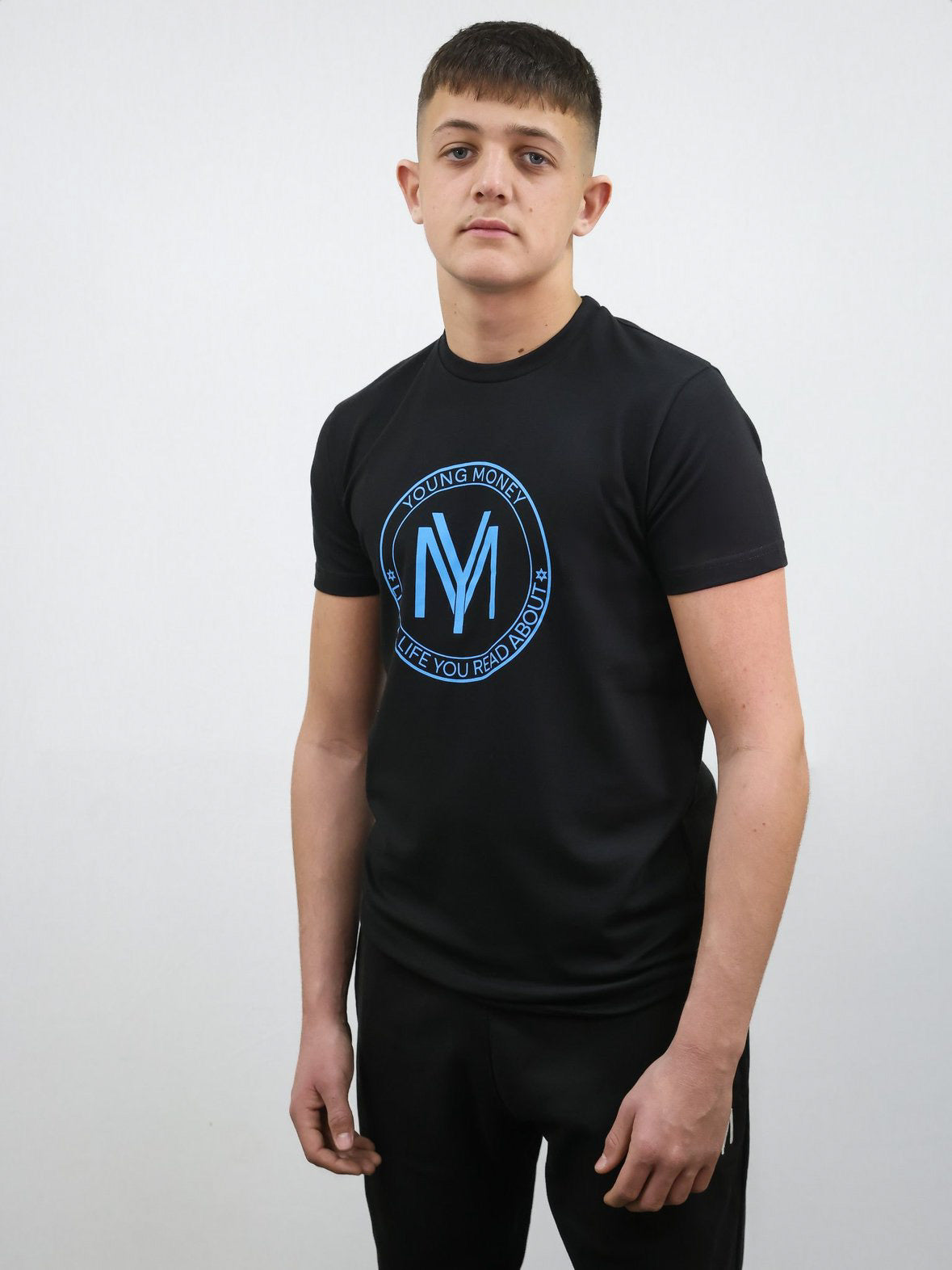 Black slim-fit T-shirt with a coloured shield design across the front with the brand's slogan in blue on a male model size medium